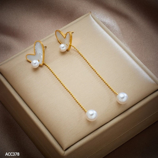 Aritos dorados de acero inoxidable con piedras blancas