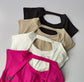 Top deportivo con aumento color fucsia y negro